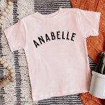 Enfants Nom personnalisé Tee<br><div class="desc">Ces t-shirts personnalisés pour enfants présentent le nom de votre enfant ou tout autre texte personnalisé dans une police voûtée moderne et élégante, ajoutant une touche ludique et unique à leur garde-robe. Fabriqués en tissu doux et de haute qualité, ces tee - shirts personnalisés sont parfaits pour l'usure quotidienne, les...</div>