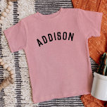 Enfants Nom personnalisé Tee<br><div class="desc">Ces t-shirts personnalisés pour enfants présentent le nom de votre enfant ou tout autre texte personnalisé dans une police voûtée moderne et élégante, ajoutant une touche ludique et unique à leur garde-robe. Fabriqués en tissu doux et de haute qualité, ces tee - shirts personnalisés sont parfaits pour l'usure quotidienne, les...</div>
