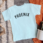Enfants Nom personnalisé Tee<br><div class="desc">Ces t-shirts personnalisés pour enfants présentent le nom de votre enfant ou tout autre texte personnalisé dans une police voûtée moderne et élégante, ajoutant une touche ludique et unique à leur garde-robe. Fabriqués en tissu doux et de haute qualité, ces tee - shirts personnalisés sont parfaits pour l'usure quotidienne, les...</div>