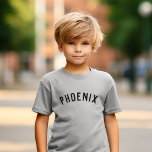 Enfants Nom personnalisé Tee<br><div class="desc">Ces t-shirts personnalisés pour enfants présentent le nom de votre enfant ou tout autre texte personnalisé dans une police voûtée moderne et élégante, ajoutant une touche ludique et unique à leur garde-robe. Fabriqués en tissu doux et de haute qualité, ces tee - shirts personnalisés sont parfaits pour l'usure quotidienne, les...</div>
