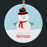 Enfants Vacances Snowman Ornement de Noël<br><div class="desc">Cet ornement de vacances présente un bonhomme de neige festif avec un foulard rouge. L'arrière - plan est bleu clair avec des flocons de neige tombants.</div>