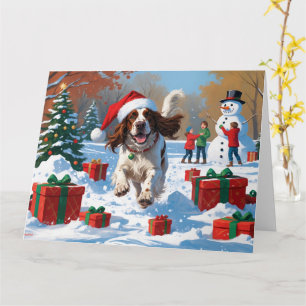Engelse Setter Rent door Sneeuw met Kerstmuts Kaart