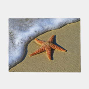Enkelvoudige Starfish op strand Deurmat