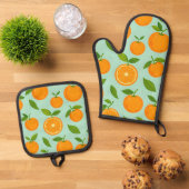 Ensemble De Gant De Cuisine Et De Manique Oranges (De haut en bas)