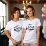 Équipe Mariée Bachelorette Soirée de Mariage<br><div class="desc">Le design typographique tendance mignon dit "Team Bride" avec cadre de défilement fantaisie. Un cadeau parfait pour la mariée, la mariée et la fête de mariage à porter tout en se préparant le jour de votre mariage! Utilisez les outils de conception pour personnaliser le design ou choisir un autre t-shirt...</div>