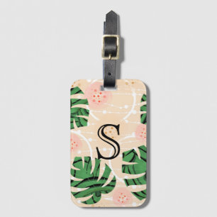 Étiquette À Bagage Feuilles de Monstera sur fond rose.