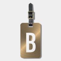 Initiale métallique balayée d'or de monogramme