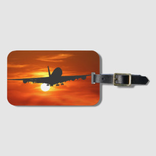 Étiquette À Bagage Les avions silhouettent contre le coucher du
