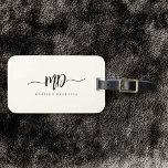 Étiquette À Bagage Moderne Monogramme Brush Script noir ivoire élégan<br><div class="desc">Chic et élégant,  cette étiquette monogramme moderne en ivoire et noir est un design minimaliste sophistiqué qui combine votre monogramme dans un script de brosse avec des fioritures le long d'élégante typographie serif.</div>