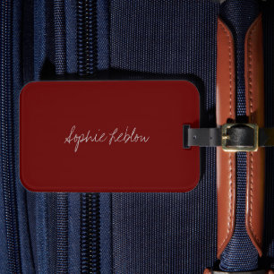 Étiquette À Bagage Nom du script juste le long d'un rouge foncé