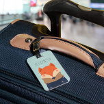 Étiquette À Bagage Tag de sac personnalisé Renard d'hiver | Mention<br><div class="desc">Cette adorable étiquette de bagage personnalisée fait un grand enfant en bas de fourre ou cadeau pour petits-enfants. Le design hivernal mignon est orné d'un arrière - plan vert menthe enneigé avec une illustration de bébé renard décorée d'un casquette et d'une écharpe d'hiver. Personnalisez avec un nom ou un monogramme...</div>