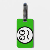 Étiquette À Bagage Visage drôle sur l'arrière - plan vert (Dos Vertical)