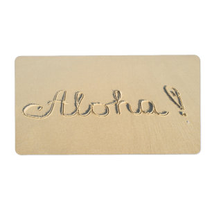Étiquette Aloha signe sur le sable de la plage