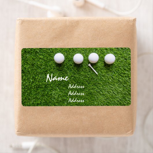 Étiquette Boules de golf et tee sur gazon vert (En situation)