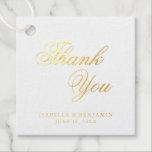 Étiquette-cadeau Merci Élégante calligraphie or Mariage à huile<br><div class="desc">Elégante typographie marnois tags avec un design simple avec le message, "Merci" en calligraphie et vos noms et date ci-dessous. Tous les éléments de conception sont en véritable feuille d'or sur un arrière - plan blanc. Ces étiquettes fantaisistes sont idéales pour un mariage formel et ajoutent une touche classieuse à...</div>