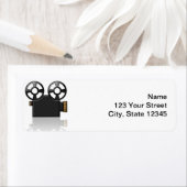 Étiquette Caméra de cinéma en noir et or sur blanc (En situation)