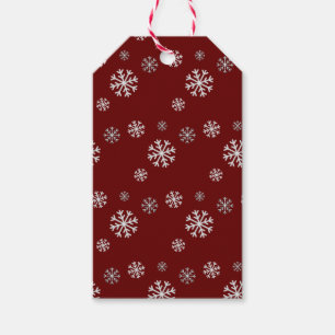 Étiquette de cadeau rouge avec chute de neige