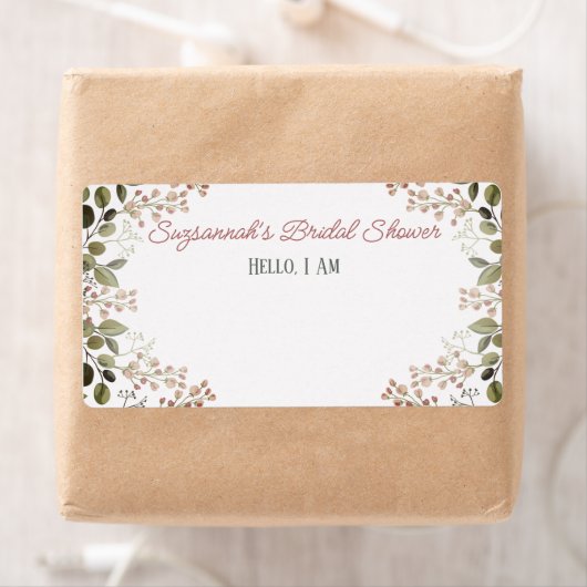 Étiquette de nom de mariage avec bordure florale e (En situation)