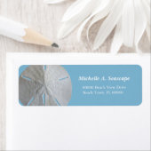 Étiquette Dollar de sable sur bleu clair (En situation)