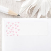 Étiquette Empreinte de patte animal. Motif rose clair et bla (En situation)