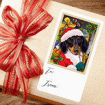 Étiquette Fun Christmas Père Noël Chien Dachshund Cadeau sac<br><div class="desc">Ajoutez un peu de charme fantaisiste avec ces stickers de enveloppes-cadeaux amusants ! Avec une illustration originale d'un mignon petit chien Daschund avec un chapeau de Père Noël et un sac plein de cadeaux. Cette conception inclut les mots "À" et "De" en écriture de script élégante, avec un espace pour...</div>
