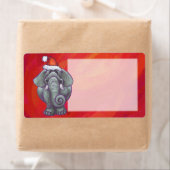 Étiquette Noël à l'éléphant sur fond rouge (En situation)