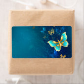 Étiquette Papillons d'or sur un Arrière - plan bleu (En situation)