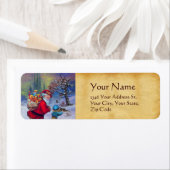 ÉTIQUETTE PÈRE NOËL AVEC JOUETS ET ENFANT DANS LA NEIGE D'HI (En situation)