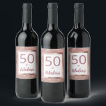Étiquette Pour Bouteilles De Vin 50 et Fabulous Rose Gold Glam 50e fête d'anniversa<br><div class="desc">Ce design à la mode et unique de glamour girly comprend les mots, "50 & Fabulous" en or rose rose vif en sans serif populaire et typographie de script avec un look à la main lettré. Les mots sont sur un arrière - plan blanc bordé de métal brossé rose bordé...</div>