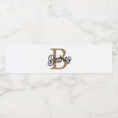 Étiquette Pour Bouteilles D'eau Monogramme moderne élégant Nom Black Gold Script (Étiquettes simples)