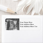 Étiquette Un club de léopard des neiges se jetant d'un arbre (En situation)