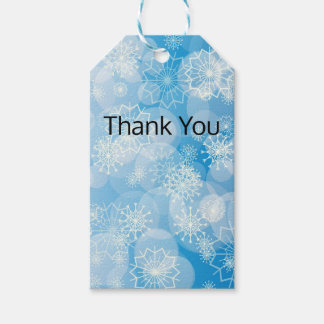 Étiquettes-cadeau Christmas snowflakes on a blue background       
