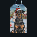 Étiquettes-cadeau Doberman Winter Wonderland Christmas Joy<br><div class="desc">Ce design festif reflète l'esprit joyeux de la période des fêtes, avec un adorable petit portant un chapeau de Père Noël. Le chien est niché dans un pays des merveilles hivernales, avec un bonhomme de neige, un sapin de Noël décoré et des cadeaux joliment emballés. Les flocons de neige tombent...</div>