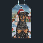 Étiquettes-cadeau Doberman Winter Wonderland Christmas Joy<br><div class="desc">Ce design festif reflète l'esprit joyeux de la période des fêtes, avec un adorable petit portant un chapeau de Père Noël. Le chien est niché dans un pays des merveilles hivernales, avec un bonhomme de neige, un sapin de Noël décoré et des cadeaux joliment emballés. Les flocons de neige tombent...</div>