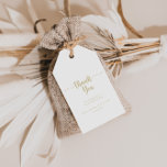 Étiquettes-cadeau Mariage de calligraphie minimaliste or Merci<br><div class="desc">Ces étiquettes de remerciement de mariage de calligraphie minimaliste or sont parfaites pour une réception de mariage rustique. Le design sobre et élégant présente une typographie de script classique et sophistiquée en or. Personnalisez ces balises avec un message court, vos noms et votre date de mariage. Vous pouvez modifier le...</div>