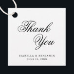 Étiquettes Cadeau Merci Elégant noir blanc Mariage de calligraphie<br><div class="desc">Élégante typographie marque de mariage avec un design simple avec le message, "Merci" en calligraphie noire et vos noms et date ci-dessous, sur un arrière - plan blanc. Les polices et les couleurs arrière - plans peuvent être changées en n'importe quelle couleur. Ces étiquettes fantaisie et classe sont parfaites pour...</div>