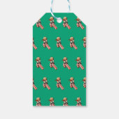 Étiquettes-cadeau Santa Claus plays on candy can slide for fun. (Dos)