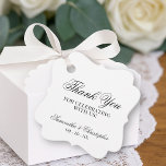 Étiquettes Cadeau Simple Élégance Merci Mariage<br><div class="desc">Ces jolis marqueurs de faveur sont simples,  classiques,  intemporels et élégants. Le design présente un fond blanc avec des lettres cursives noires en dentelle qui disent : Merci de célébrer avec nous. Il y a un espace pour les noms des mariés et la date du mariage.</div>