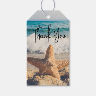 Étiquettes-cadeau Starfish sur une plage de sable Photographie Merci