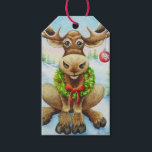 Étiquettes-cadeau Whimsical Winter Christmas Moose Watercolor Art<br><div class="desc">"Christmas Moose" Aquarelle Art Tags by Artist Jean Weiner "Christmas Moose" présente une orignal d'hiver prêt à célébrer Noël. L'orignal porte une couronne fraîche de verdures saintes autour de son cou. La couronne a des baies rouges et un arc rouge vif. Il y a un ornement rond, rouge, en verre,...</div>