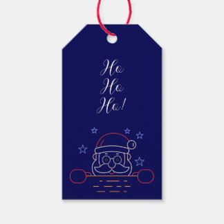 Étiquettes de cadeaux du Père Noël dans la cheminé