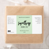 Étiquettes modernes du sérum à visage vert (En situation)