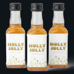 Étiquettes Pour Bouteilles De Liqueur Holly Jolly | Fun Christmas White & Gold Mini<br><div class="desc">Simple Christmas White & Gold Mini Étiquette bouteille d'alcool de Noël avec texte "Holly Jolly" dans un style de typographie amusant mais élégant et étoiles étincelantes. Personnaliser avec le nom de l'expéditeur. Mélanger et correspondre avec d'autres modèles de cette série.</div>