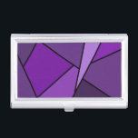 Étui Pour Cartes De Visite Polygones violets Abstraits<br><div class="desc">Inspiré par le vitrail, ce design géométrique élégant contient des polygones dans différentes nuances de violet, encadrés en noir. Un triangle de lavande s'élance de la partie supérieure droite avec un ensemble de quadrangles violets progressivement plus foncés et d'autres formes qui s'enroulent autour de lui de la lumière à l'obscurité....</div>