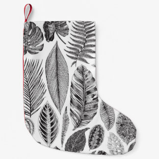 Exotische bladeren, bloemenzwart en wit. kleine kerstsok