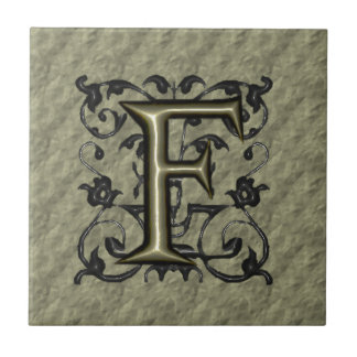 F -  monogram in reliëfdruk (goud) tegeltje