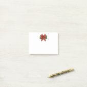 Feestelijke rode en gouden kerstboog post-it® notes (Op bureau)