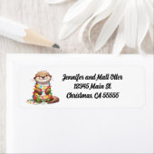 Feestelijke Schattigee kerst otter gewikkeld in Li Etiket (Insitu)