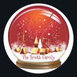 Festif Red & White Christmas Village Snow Globe<br><div class="desc">Festive boule de neige du village de Noël avec ciel rouge et chute de neige. Personnalisez avec votre nom. Profite.</div>