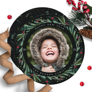 Festive nieuwjaar met grote overblijfselen rond de feestdagenkaart